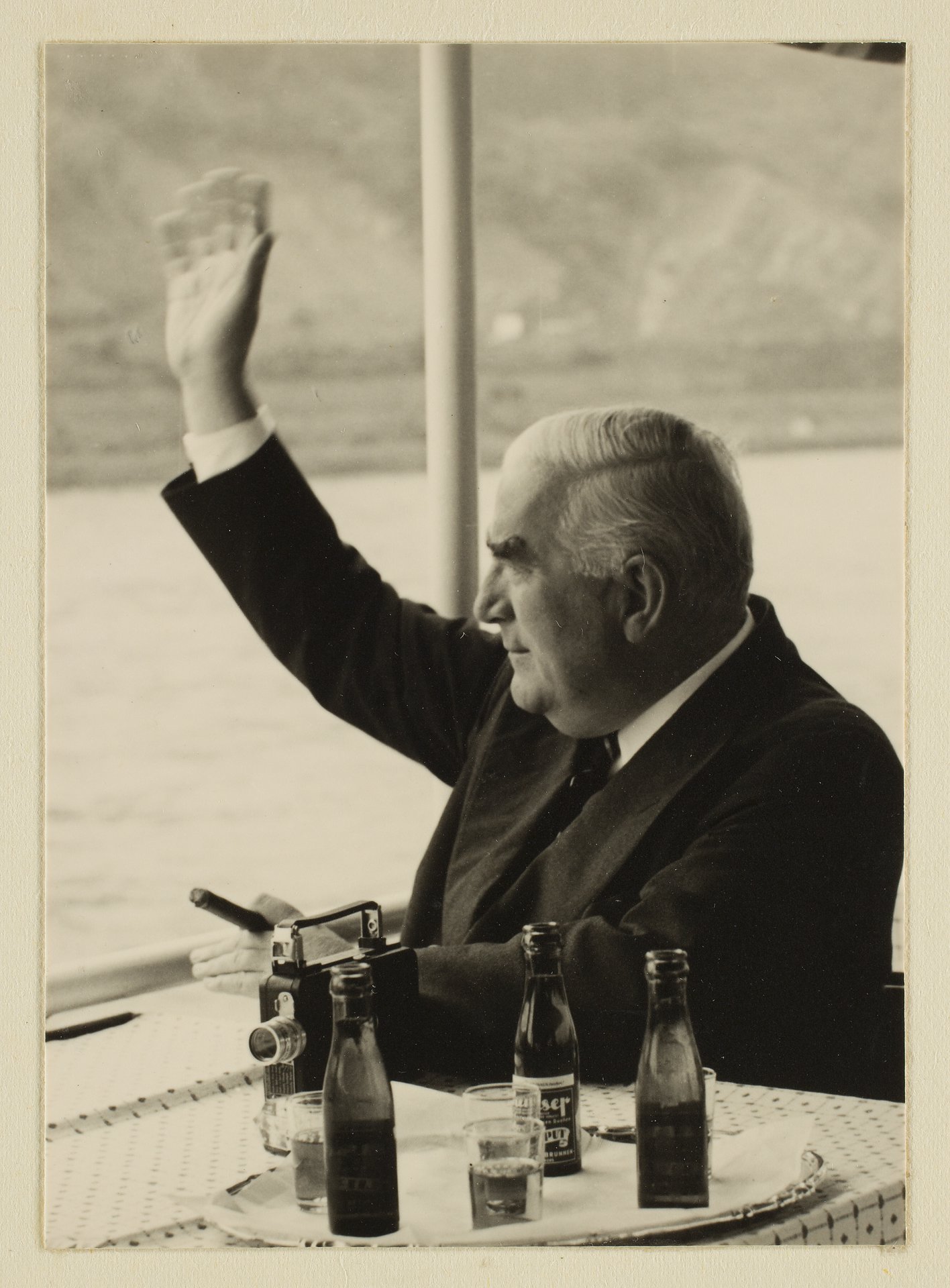 Robert Menzies, in profile, waving from a boat on the Rhine during a visit to Germany in 1956